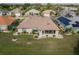 Single-story home with sunroom and nicely landscaped backyard in a residential community at 739 Winterbrooke Way, Sun City Center, FL 33573