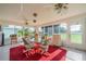 Sunroom with glass windows and seating area at 739 Winterbrooke Way, Sun City Center, FL 33573