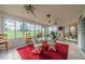 Sunroom with glass windows and seating area at 739 Winterbrooke Way, Sun City Center, FL 33573
