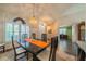 Spacious dining room with hardwood floors and access to kitchen at 739 Winterbrooke Way, Sun City Center, FL 33573