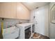 Bright laundry room with washer, dryer, and utility sink at 739 Winterbrooke Way, Sun City Center, FL 33573