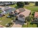Single story house with a two car garage,solar panels and well maintained landscaping at 739 Winterbrooke Way, Sun City Center, FL 33573