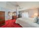 Main bedroom with a post bed and access to the bathroom at 739 Winterbrooke Way, Sun City Center, FL 33573