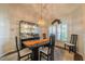 Elegant dining room with chandelier and large windows at 739 Winterbrooke Way, Sun City Center, FL 33573
