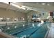 Indoor swimming pool with multiple lanes for lap swimming at 739 Winterbrooke Way, Sun City Center, FL 33573