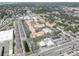 Aerial view of an apartment complex with a pool and surrounding buildings at 10764 70Th Ave # 3303, Seminole, FL 33772