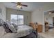 Cozy bedroom with ceiling fan and ample closet space at 10764 70Th Ave # 3303, Seminole, FL 33772