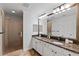 Modern bathroom with double vanity, granite countertop, and glass shower at 12033 Gandy N Blvd # 165, St Petersburg, FL 33702