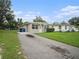 House exterior showcasing landscaping and driveway at 5300 6Th S Ave, St Petersburg, FL 33707