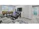 Bright living room with comfortable seating and storage at 35744 Jenny Lynne Cir, Zephyrhills, FL 33541