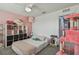 Lovely bedroom with a queen bed and cat tree at 35744 Jenny Lynne Cir, Zephyrhills, FL 33541