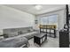Cozy living room with sectional sofa and modern decor at 35744 Jenny Lynne Cir, Zephyrhills, FL 33541