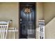 Stylish black front door adorned with a fall wreath at 35744 Jenny Lynne Cir, Zephyrhills, FL 33541