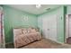 Charming bedroom with a daybed and built-in closet at 35744 Jenny Lynne Cir, Zephyrhills, FL 33541