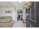 Bright and airy entryway with tile floors and views into the living area at 35744 Jenny Lynne Cir, Zephyrhills, FL 33541