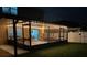 Covered patio at night with string lights and outdoor furniture at 35744 Jenny Lynne Cir, Zephyrhills, FL 33541