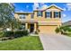 Two-story house with a two-car garage at 35744 Jenny Lynne Cir, Zephyrhills, FL 33541