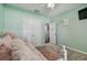 Light and airy bedroom with a daybed and access to a hallway at 35744 Jenny Lynne Cir, Zephyrhills, FL 33541