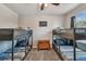 Spacious bedroom with two sets of bunk beds at 35744 Jenny Lynne Cir, Zephyrhills, FL 33541
