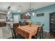 Bright dining room with a stylish light fixture and plaid tablecloth at 35744 Jenny Lynne Cir, Zephyrhills, FL 33541