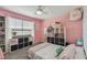 Bright bedroom with a queen bed and fun decor at 35744 Jenny Lynne Cir, Zephyrhills, FL 33541