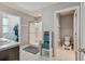 Clean bathroom with shower, toilet and storage at 35744 Jenny Lynne Cir, Zephyrhills, FL 33541