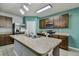 Spacious kitchen with ample cabinetry and a large island at 35744 Jenny Lynne Cir, Zephyrhills, FL 33541