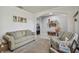 Spacious living room featuring a comfortable couch and seating area at 35744 Jenny Lynne Cir, Zephyrhills, FL 33541
