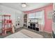 Bedroom with a queen bed, cat tree, and fish tank at 35744 Jenny Lynne Cir, Zephyrhills, FL 33541