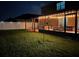 Night view of backyard with screened patio and swingset at 35744 Jenny Lynne Cir, Zephyrhills, FL 33541