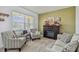 Cozy living room with fireplace and comfortable seating at 35744 Jenny Lynne Cir, Zephyrhills, FL 33541
