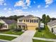 Aerial view of two-story house with landscaping and a neighborhood view at 35744 Jenny Lynne Cir, Zephyrhills, FL 33541