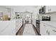 Modern kitchen with stainless steel appliances and white cabinets at 9733 Long Meadow Dr, Tampa, FL 33615