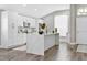 Modern kitchen with white cabinets, quartz countertops, and island at 9733 Long Meadow Dr, Tampa, FL 33615