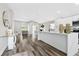 Open concept kitchen with island and view of living area at 9733 Long Meadow Dr, Tampa, FL 33615