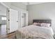 Guest bedroom with gray headboard and spacious closet at 9733 Long Meadow Dr, Tampa, FL 33615