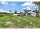 Large backyard with a screened pool and plenty of space for outdoor activities at 9733 Long Meadow Dr, Tampa, FL 33615
