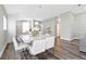 Bright dining room with white table and chairs at 9733 Long Meadow Dr, Tampa, FL 33615