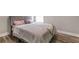 Charming bedroom with a queen bed, light walls, and light wood floors at 9733 Long Meadow Dr, Tampa, FL 33615