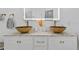 Modern bathroom with double sinks, gold faucets, and marble countertops at 9733 Long Meadow Dr, Tampa, FL 33615