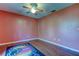 Cozy bedroom with wood floors and colorful rug at 12917 Rain Forest St, Temple Terrace, FL 33617