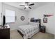 Spacious bedroom with ceiling fan and large bed at 21395 Southern Charm Dr, Land O Lakes, FL 34637