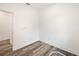 Empty spare bedroom with light grey vinyl plank flooring and white walls at 1710 E Nome St, Tampa, FL 33604