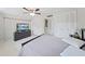 Spacious bedroom with TV, neutral paint, and ample closet space at 1385 Embassy Dr, Clearwater, FL 33764