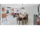 Dining room with open concept to kitchen and access to the lanai at 1385 Embassy Dr, Clearwater, FL 33764
