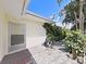 Exterior view of a home, showing the home's exterior, pump and a landscaped side yard at 1385 Embassy Dr, Clearwater, FL 33764