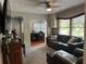 Living room with brown leather furniture, a dining area, and a view of the kitchen at 5485 72Nd N Ave, Pinellas Park, FL 33781