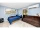 Cozy bedroom featuring a large dresser and a comfortable bed with bright natural light at 6619 Livingston N Ave, St Petersburg, FL 33702
