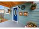 Charming home featuring a bright blue front door and well-maintained exterior details at 6619 Livingston N Ave, St Petersburg, FL 33702