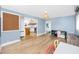 Spacious living room with laminate flooring and an open floor plan that flows into the kitchen and dining area at 6619 Livingston N Ave, St Petersburg, FL 33702